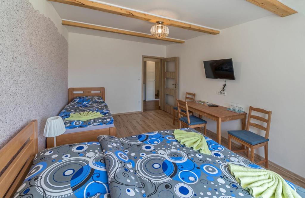 Postel nebo postele na pokoji v ubytování Berunka
