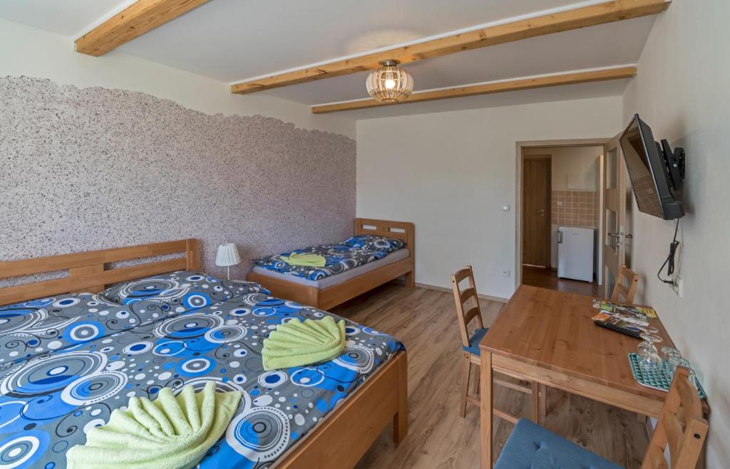 Postel nebo postele na pokoji v ubytování Berunka