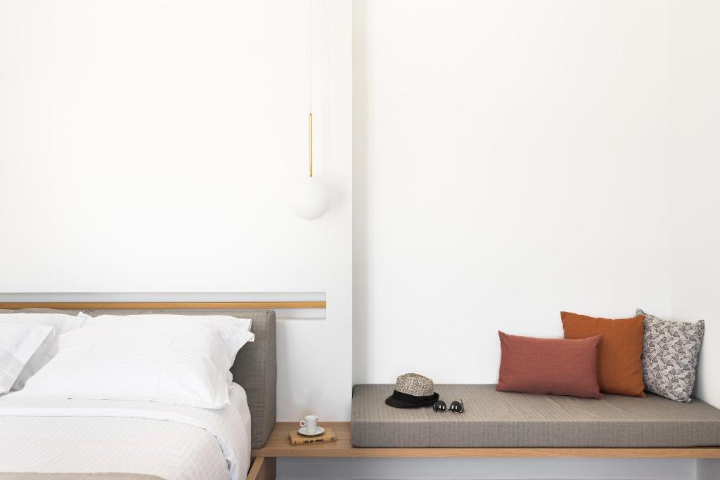 Postel nebo postele na pokoji v ubytování Mykonos Soul Luxury Suites