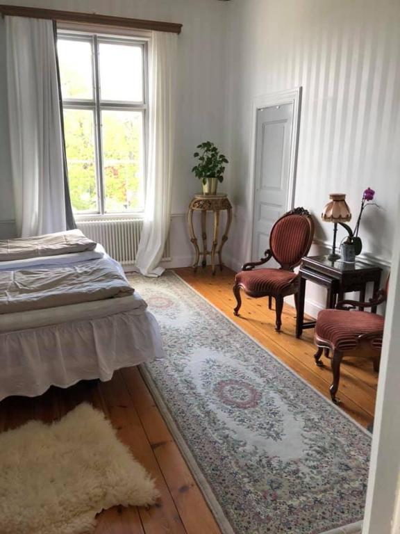 Postel nebo postele na pokoji v ubytování Amiralsgården Verstorp