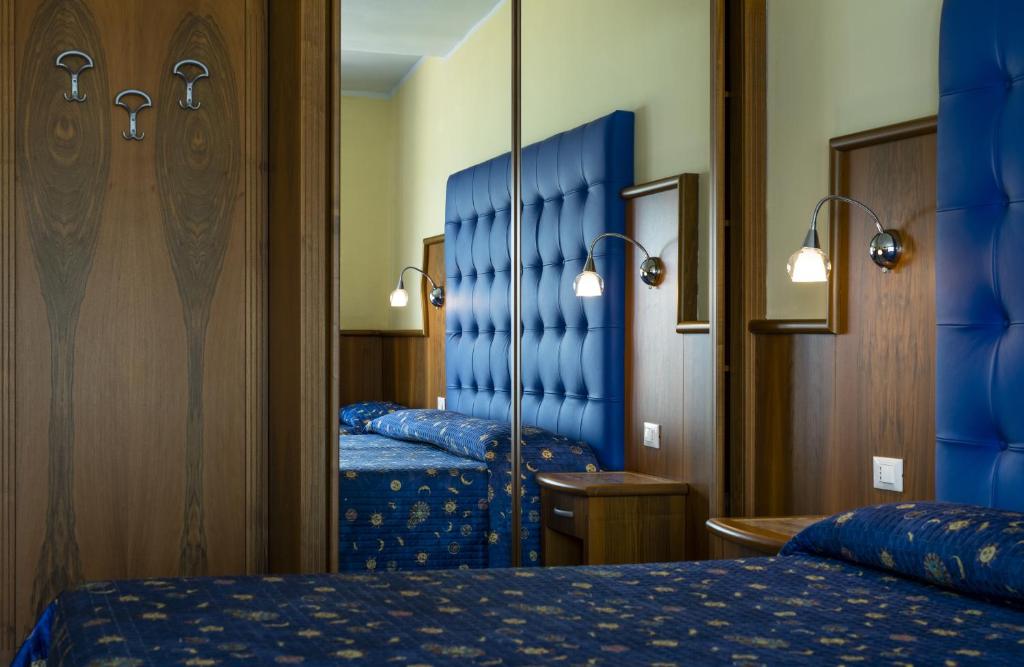 Łóżko lub łóżka w pokoju w obiekcie Hotel Panoramic