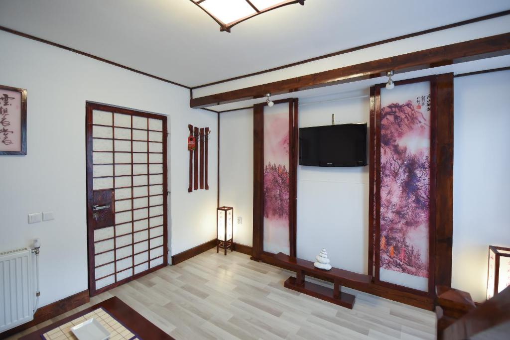 TV tai viihdekeskus majoituspaikassa Casa Lily - Japanese Retreat
