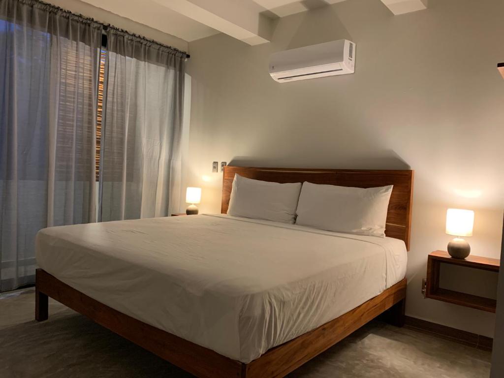 Postel nebo postele na pokoji v ubytování Hotel Muyu Tulum