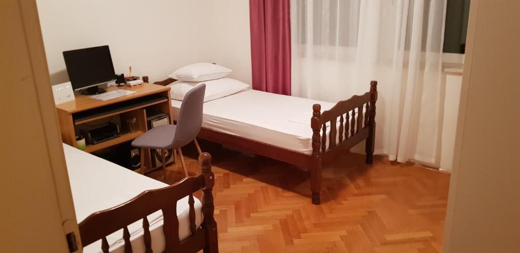Postel nebo postele na pokoji v ubytování Apartman "Lara"