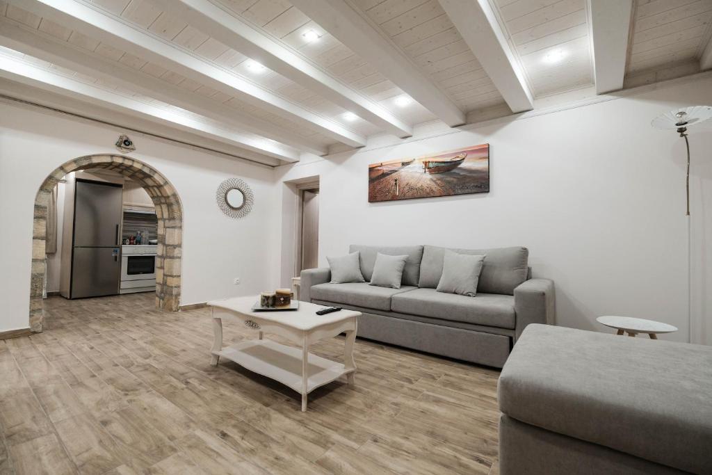 a living room with a couch and a table at Old Town Diamond in Rhodes Town