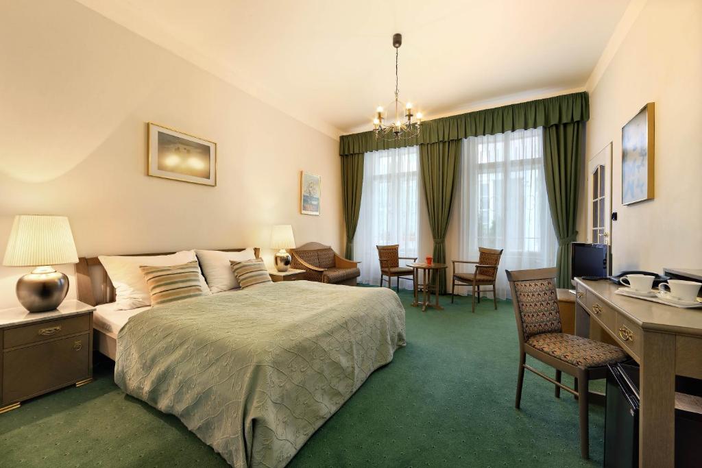 Postel nebo postele na pokoji v ubytování Hotel Salvator