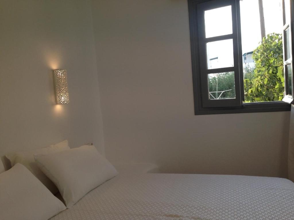 Postel nebo postele na pokoji v ubytování Maistrali Studios & Apartments