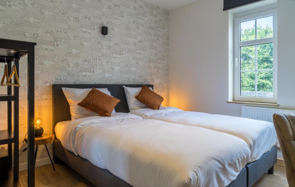 Postel nebo postele na pokoji v ubytování Hotel Huron