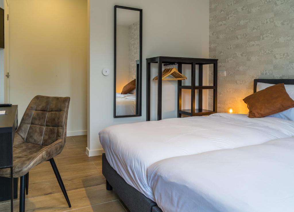 Postel nebo postele na pokoji v ubytování Hotel Huron