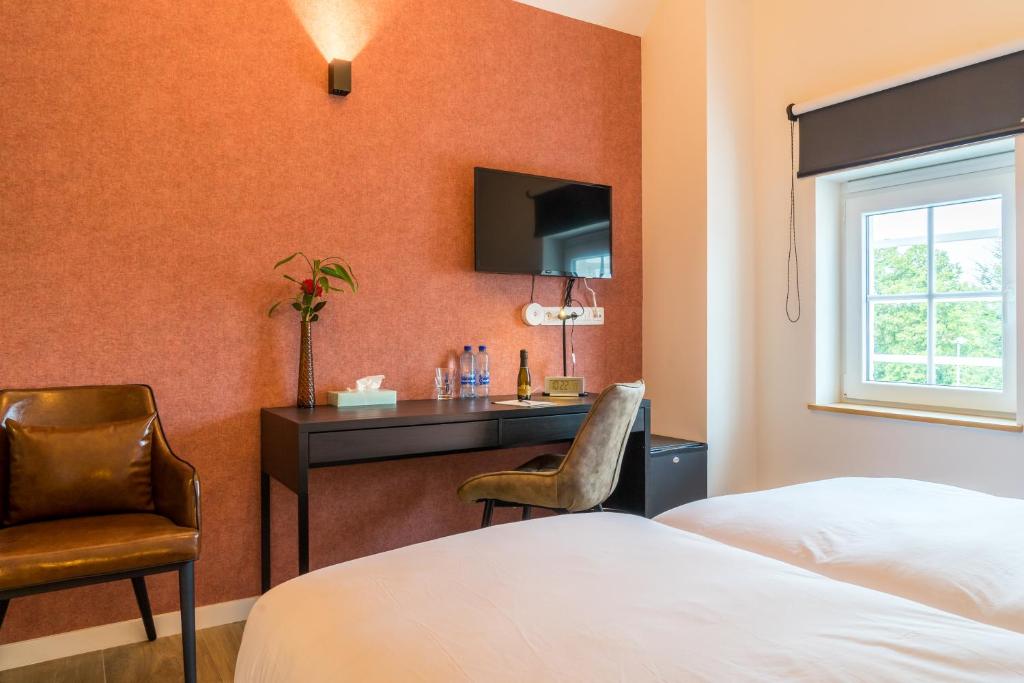 Postel nebo postele na pokoji v ubytování Hotel Huron