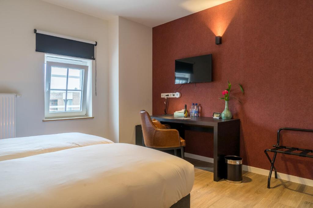 Postel nebo postele na pokoji v ubytování Hotel Huron