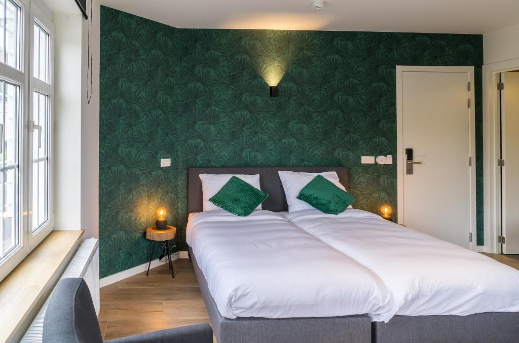 Postel nebo postele na pokoji v ubytování Hotel Huron
