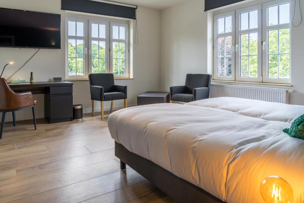 Postel nebo postele na pokoji v ubytování Hotel Huron