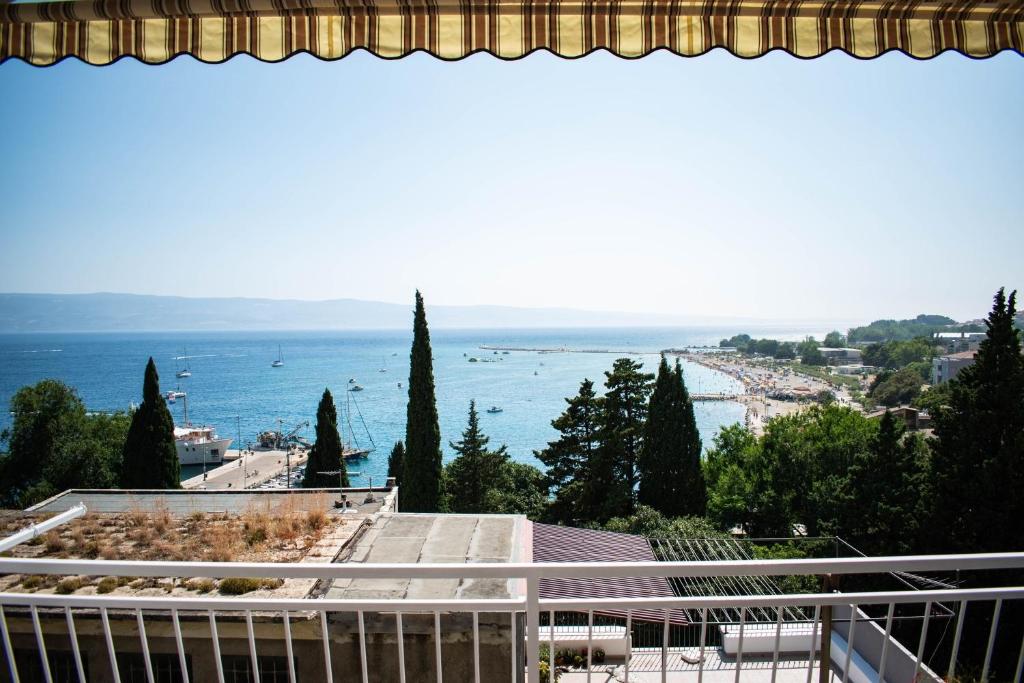 a view of the ocean from a balcony at Apartments Ozren-amazing sea view in Omiš