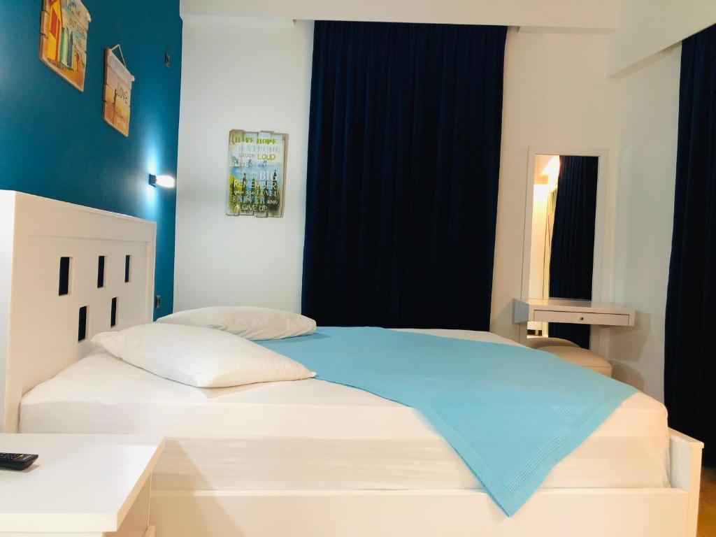 Postel nebo postele na pokoji v ubytování Envi Hotel