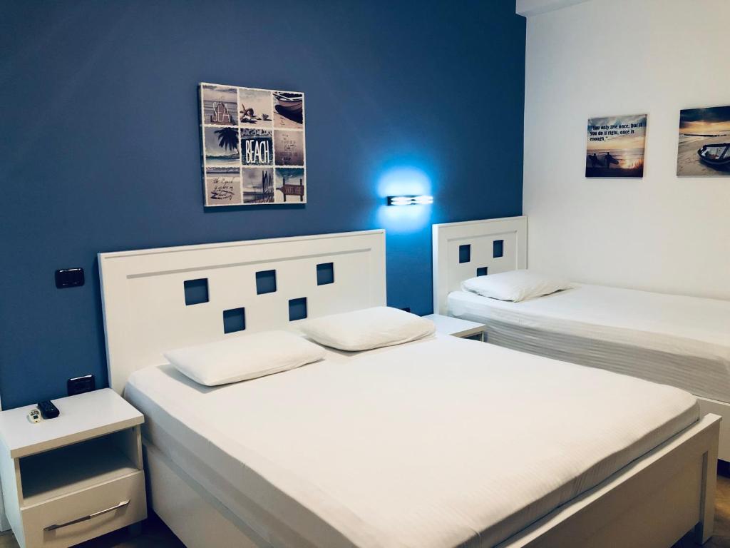 Postel nebo postele na pokoji v ubytování Envi Hotel