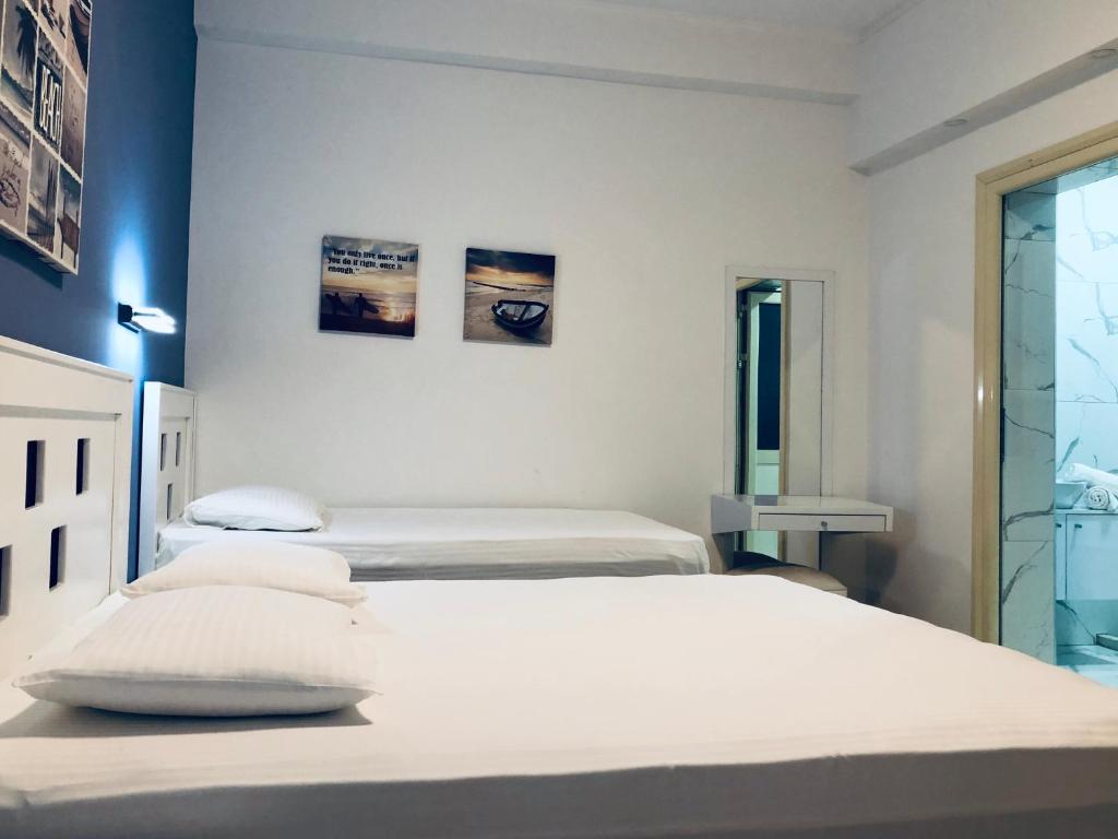 Postel nebo postele na pokoji v ubytování Envi Hotel