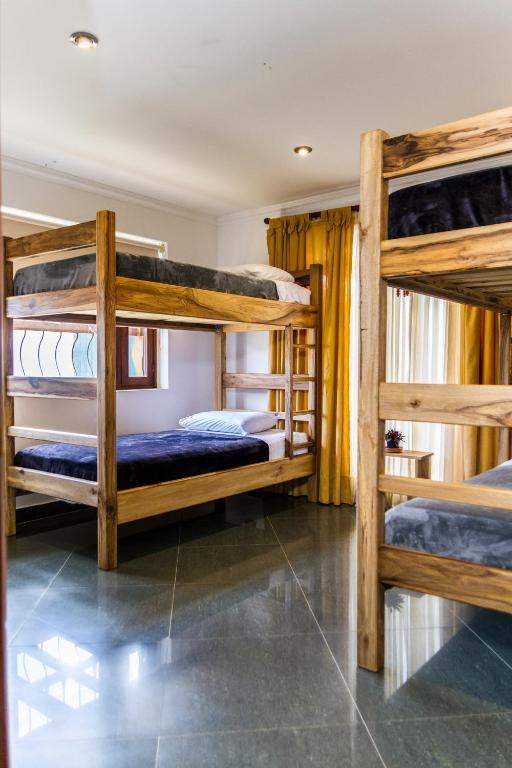 Voodi või voodid majutusasutuse Nibiru Hostel toas