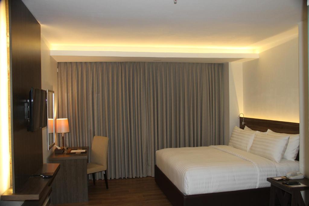 Postel nebo postele na pokoji v ubytování Hotel Marciano