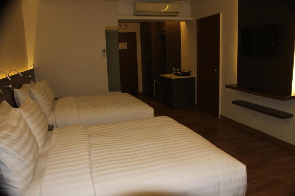 Postel nebo postele na pokoji v ubytování Hotel Marciano