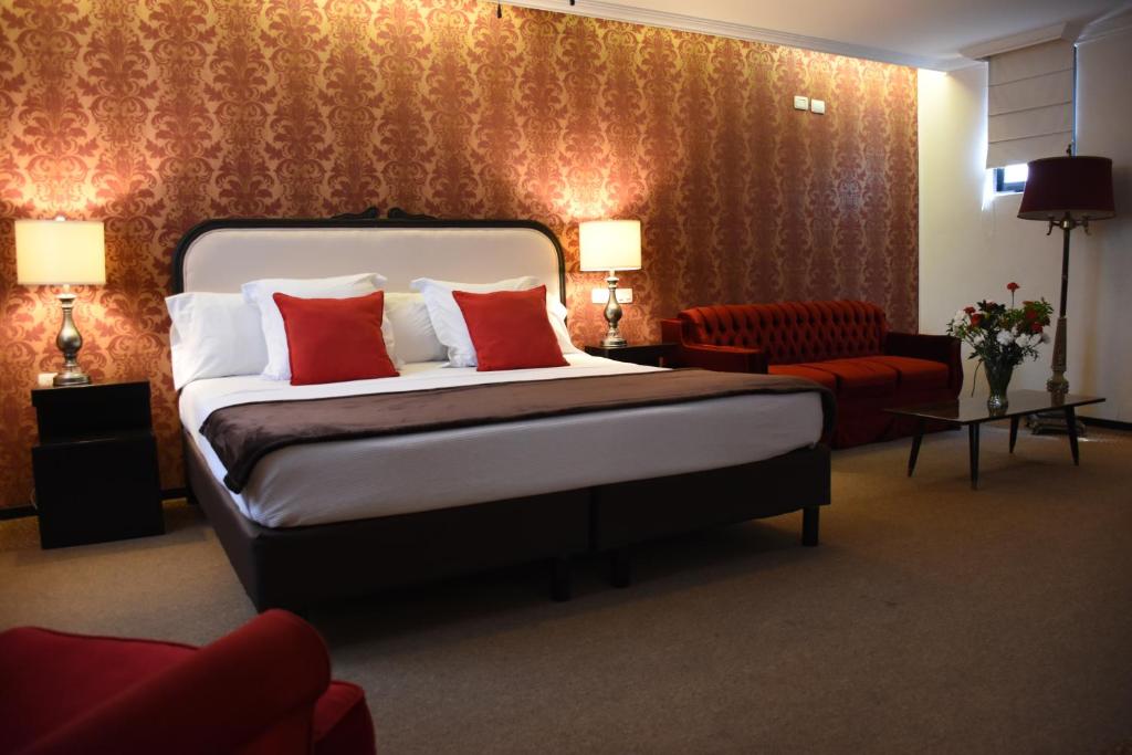 Postel nebo postele na pokoji v ubytování Hotel Clara Luna