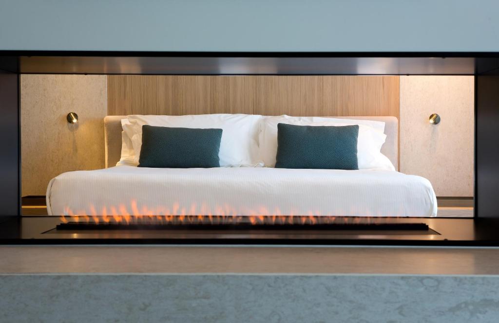 Postel nebo postele na pokoji v ubytování Hotel Terme Neroniane