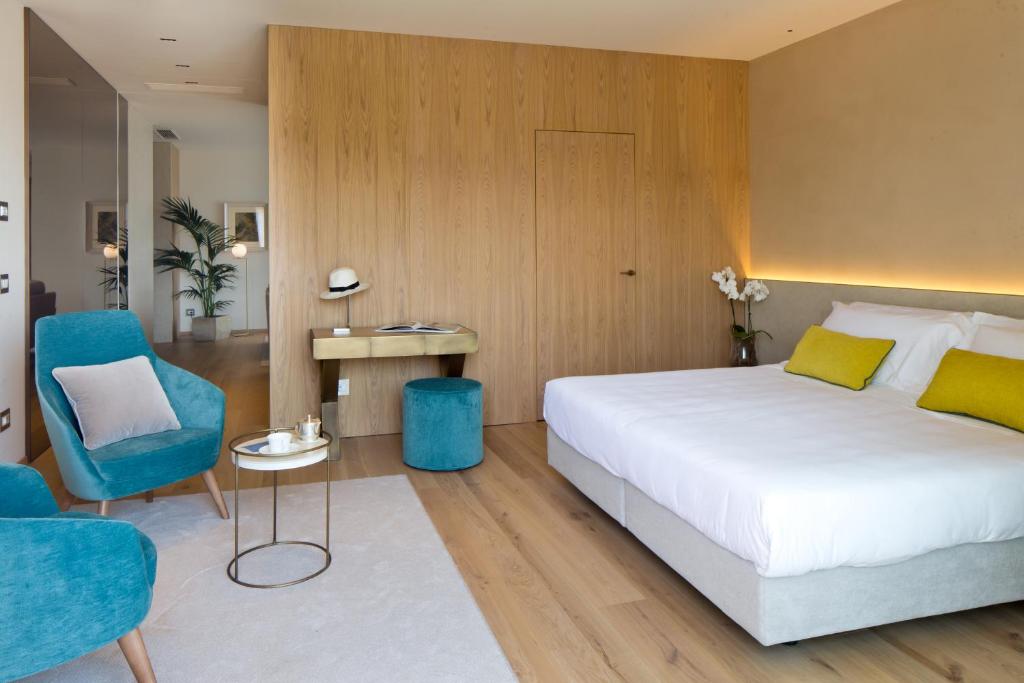 Postel nebo postele na pokoji v ubytování Hotel Terme Neroniane