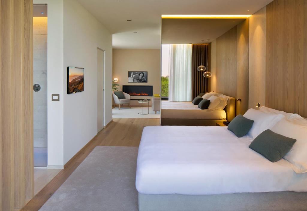 Postel nebo postele na pokoji v ubytování Hotel Terme Neroniane