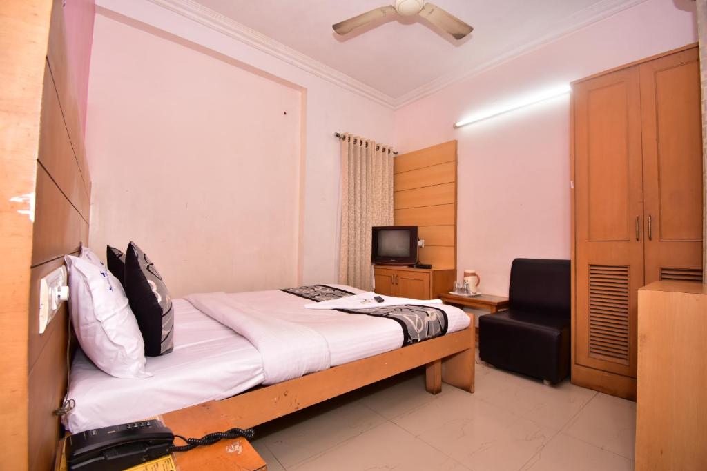 Postel nebo postele na pokoji v ubytování Samudra Residency