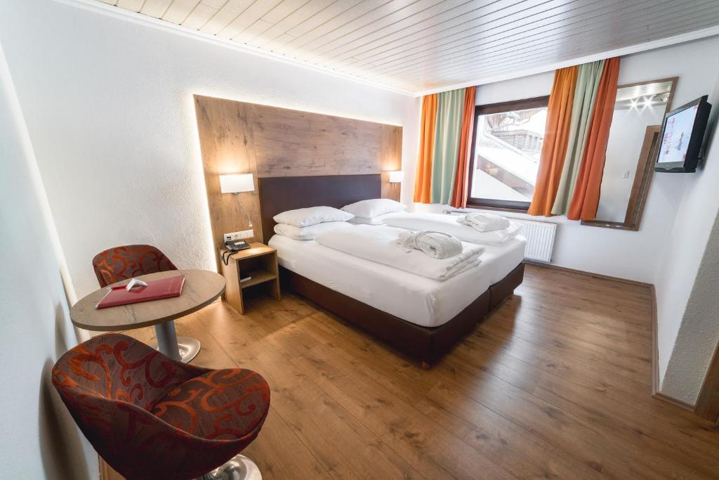 Postel nebo postele na pokoji v ubytování Alpen Adria Hotel & Spa