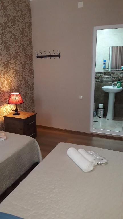 Postel nebo postele na pokoji v ubytování MANGO Guesthouse