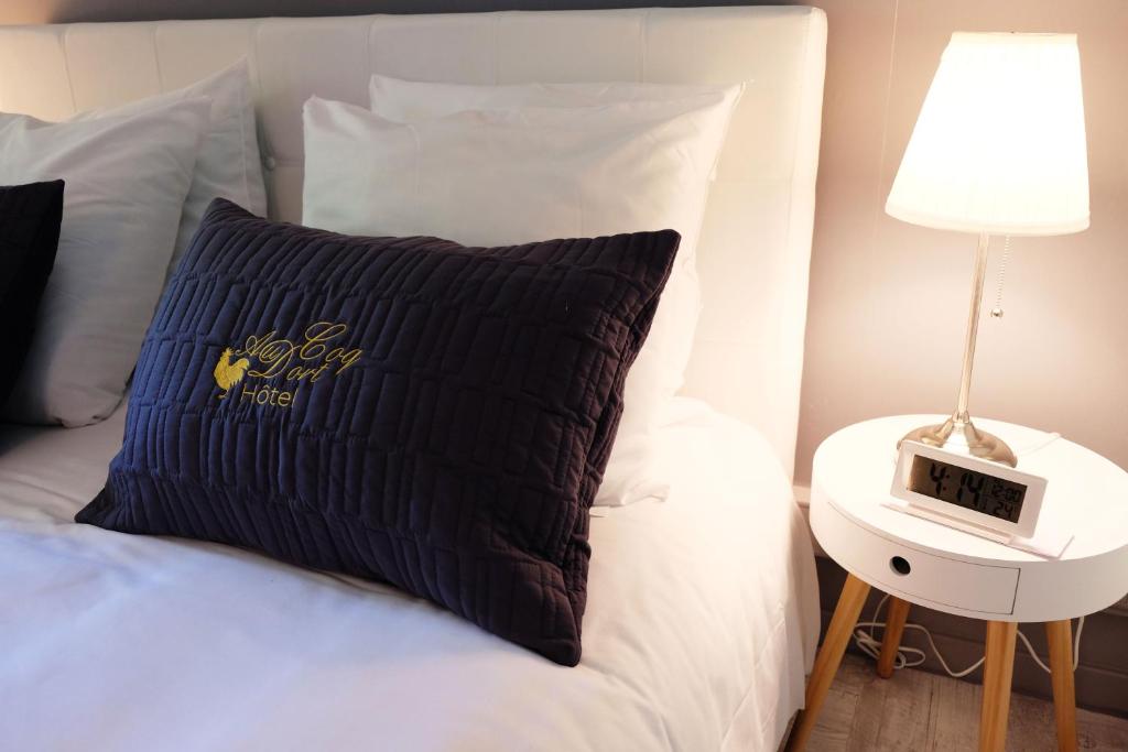 Postel nebo postele na pokoji v ubytování Hôtel Au Coq Dort Spa