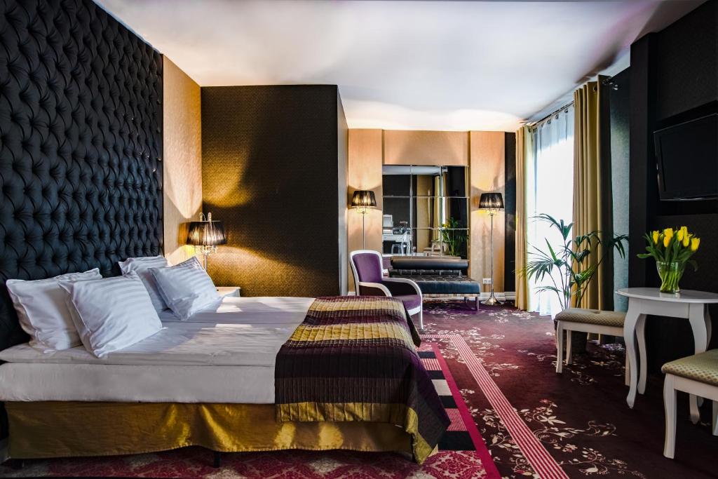 Postel nebo postele na pokoji v ubytování Hotel Lamberton