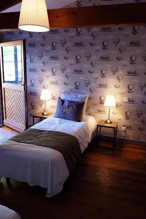 Postel nebo postele na pokoji v ubytování Hôtel Au Coq Dort Spa