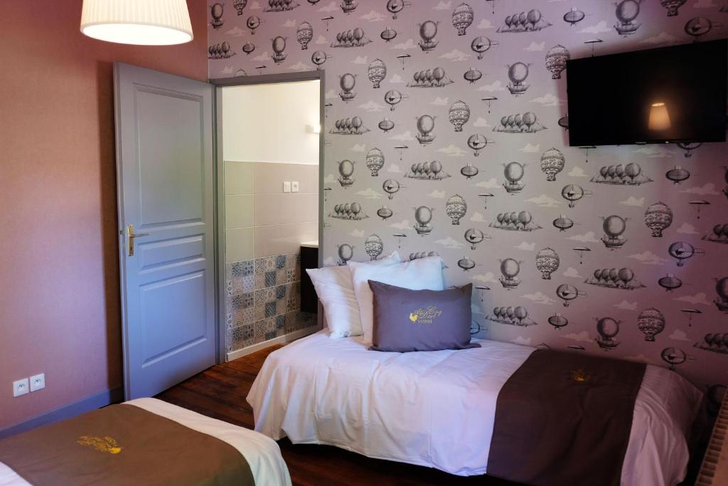 Postel nebo postele na pokoji v ubytování Hôtel Au Coq Dort Spa