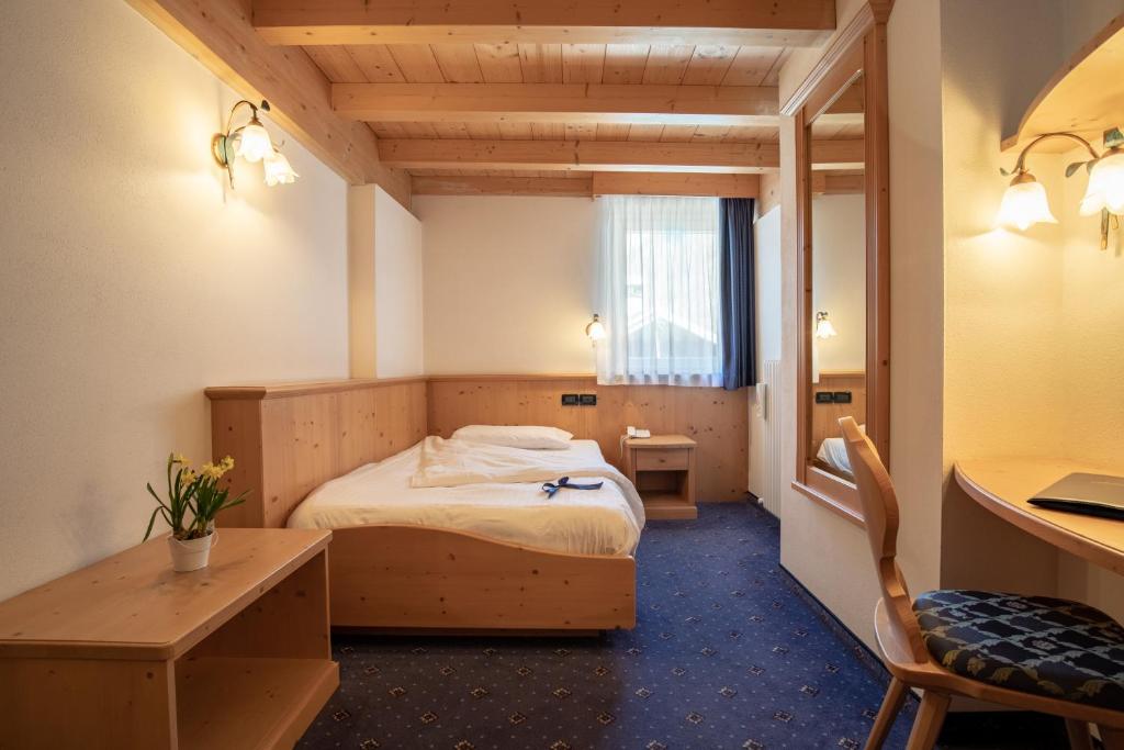 Postel nebo postele na pokoji v ubytování Hotel Siror