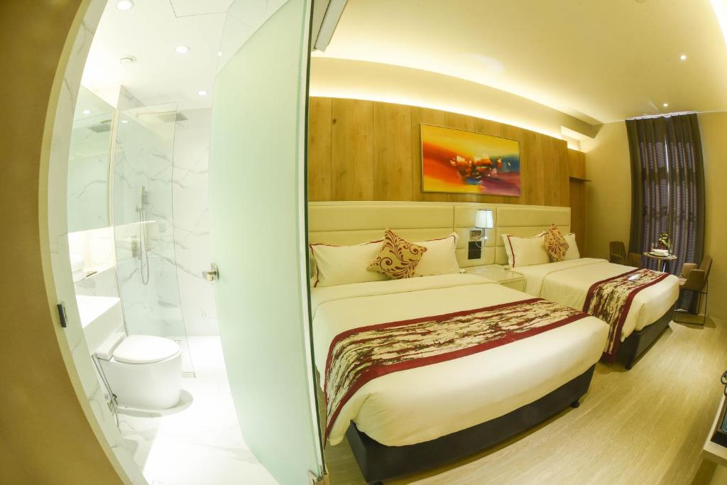 Postel nebo postele na pokoji v ubytování Red Hotel Cubao, Quezon City