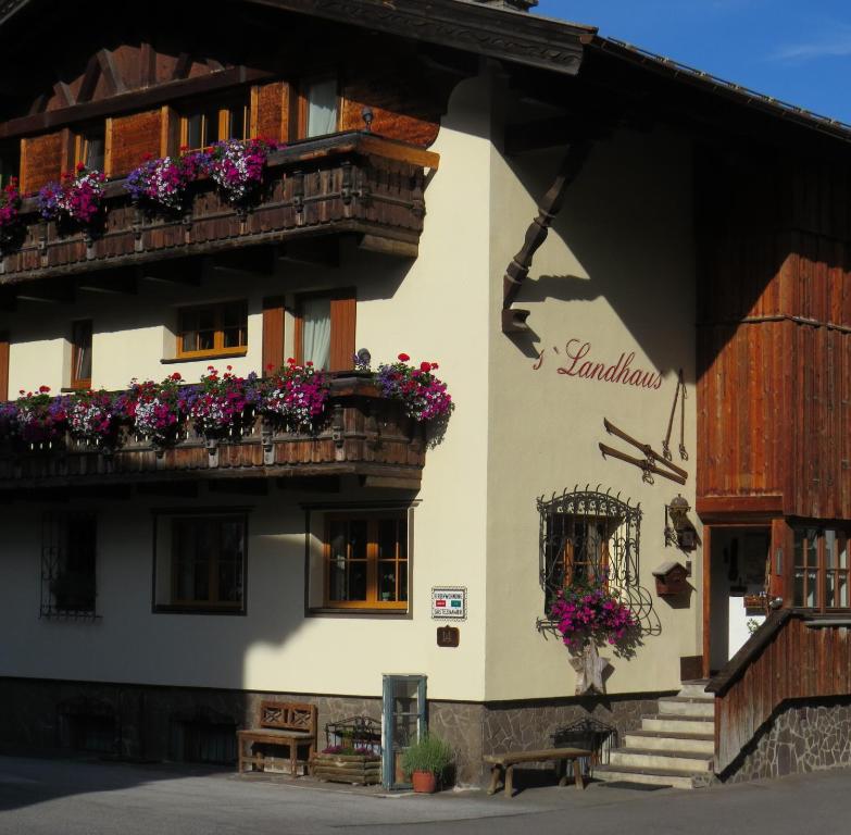 a building with flower boxes on the balconies at s'Landhaus in Sankt Anton am Arlberg
