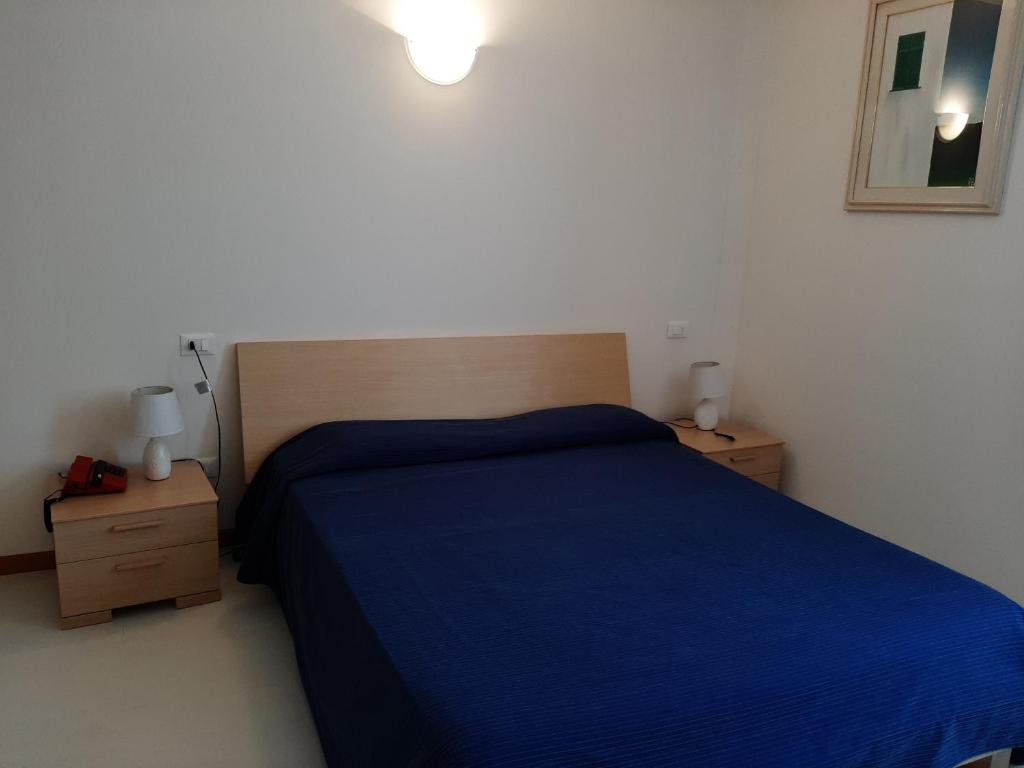 Postel nebo postele na pokoji v ubytování Hotel Residence Mondial
