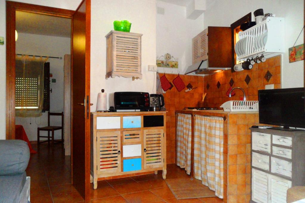 a kitchen with a sink and a counter top at La casa di Maya in Sassari