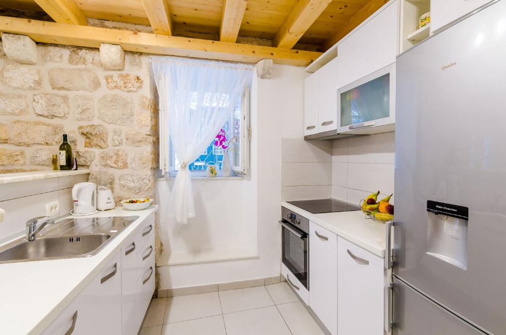 Kuchyňa alebo kuchynka v ubytovaní Apartment Little Star II