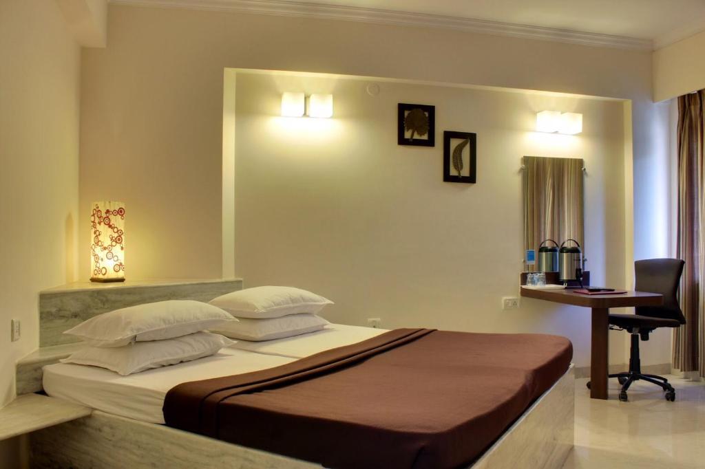 Postel nebo postele na pokoji v ubytování Regenta Inn Palacio De Goa, Panjim