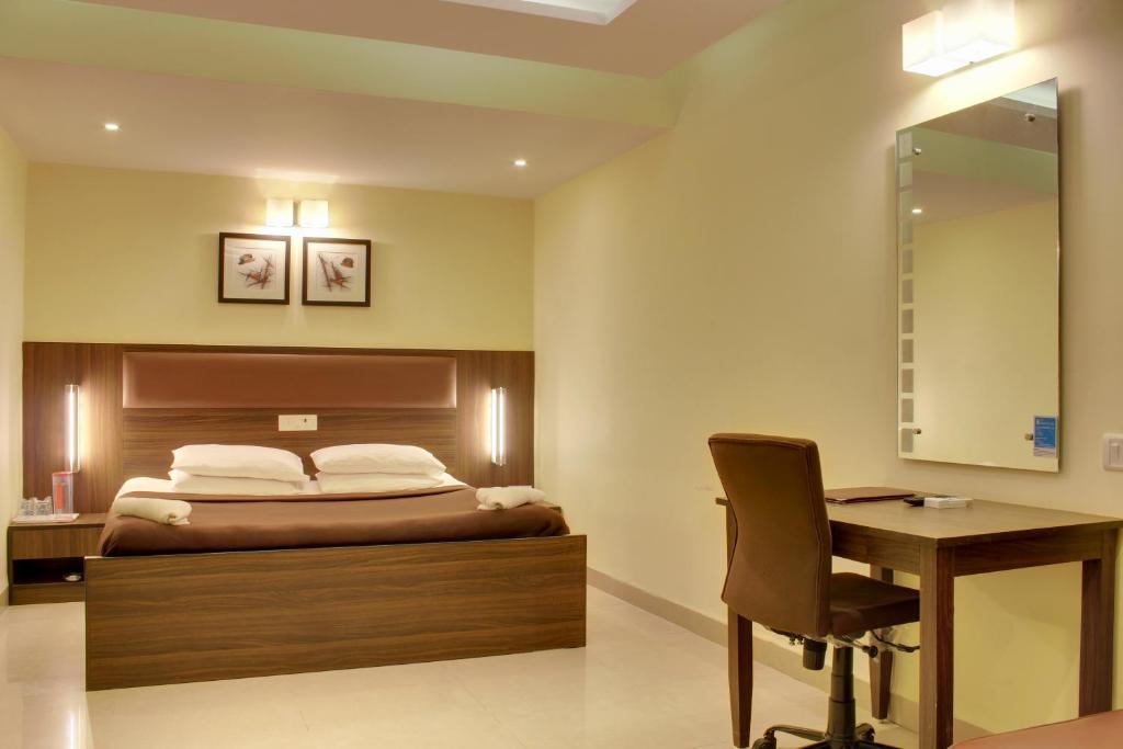 Postel nebo postele na pokoji v ubytování Regenta Inn Palacio De Goa, Panjim