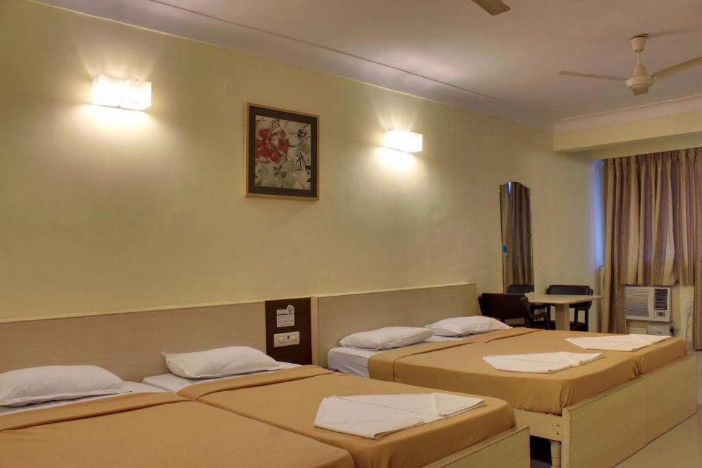 Postel nebo postele na pokoji v ubytování Regenta Inn Palacio De Goa, Panjim