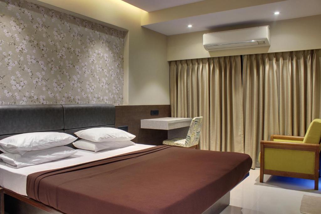 Postel nebo postele na pokoji v ubytování Regenta Inn Palacio De Goa, Panjim