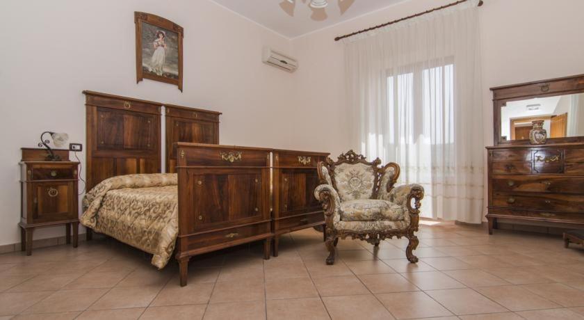 Postel nebo postele na pokoji v ubytování B&B Il Giardino Dei Mandarini
