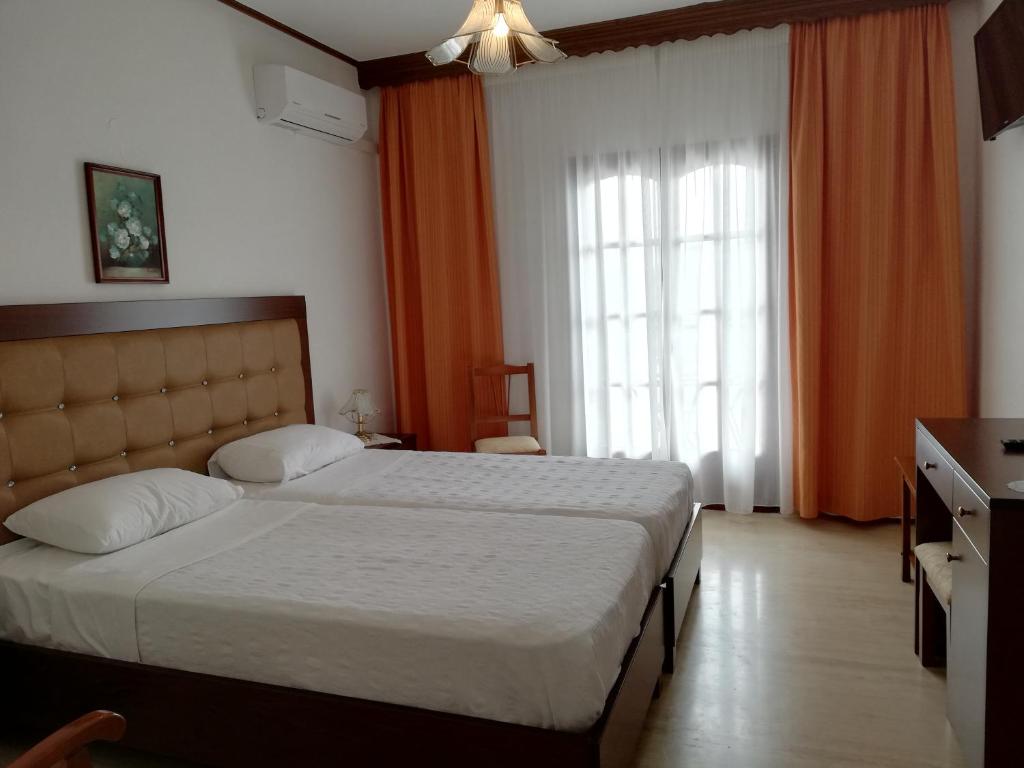 Postel nebo postele na pokoji v ubytování Hotel Paradise