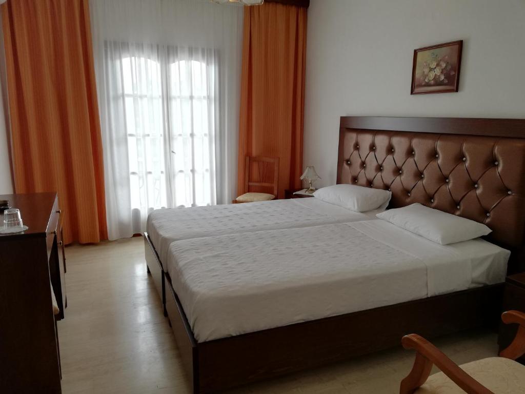 Postel nebo postele na pokoji v ubytování Hotel Paradise