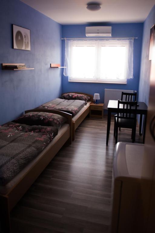 Postel nebo postele na pokoji v ubytování Penzion Veritas
