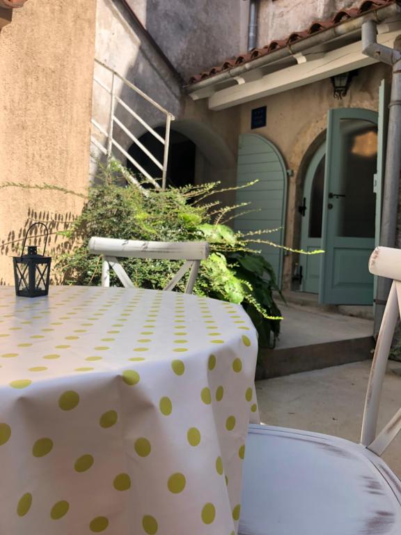 a table with a polka dot table cloth on it at Apartment Susanj in Mošćenice